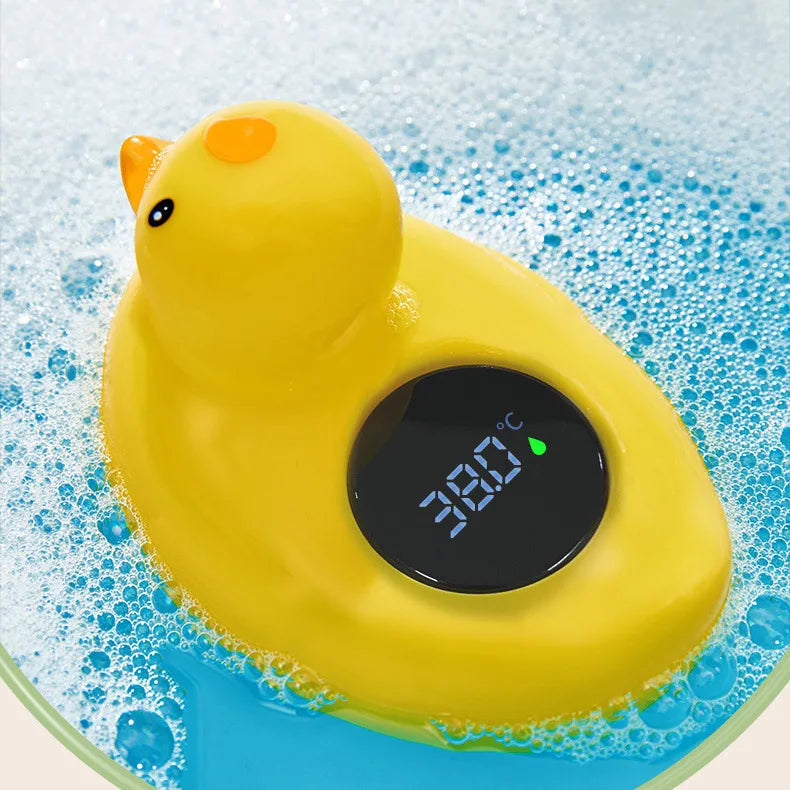 Floating baby bath thermometer measuring water temperature in tub