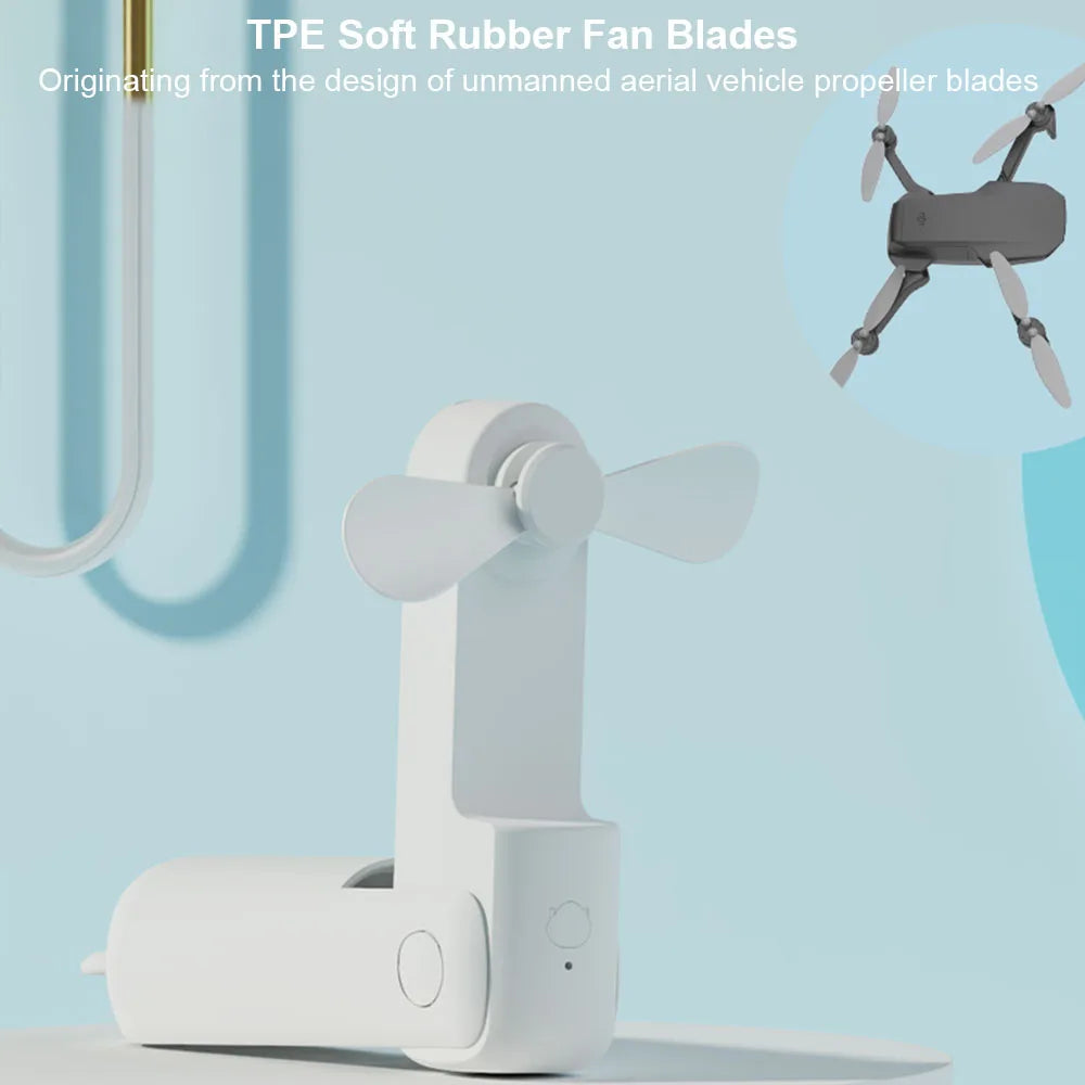 White handheld fan with TPE soft rubber fan blades on a light blue background