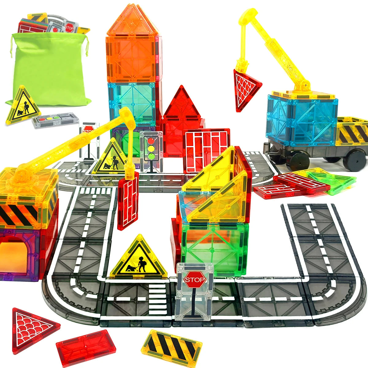 Toy construction set with colorful buildings, vehicles, and traffic signs on a white background