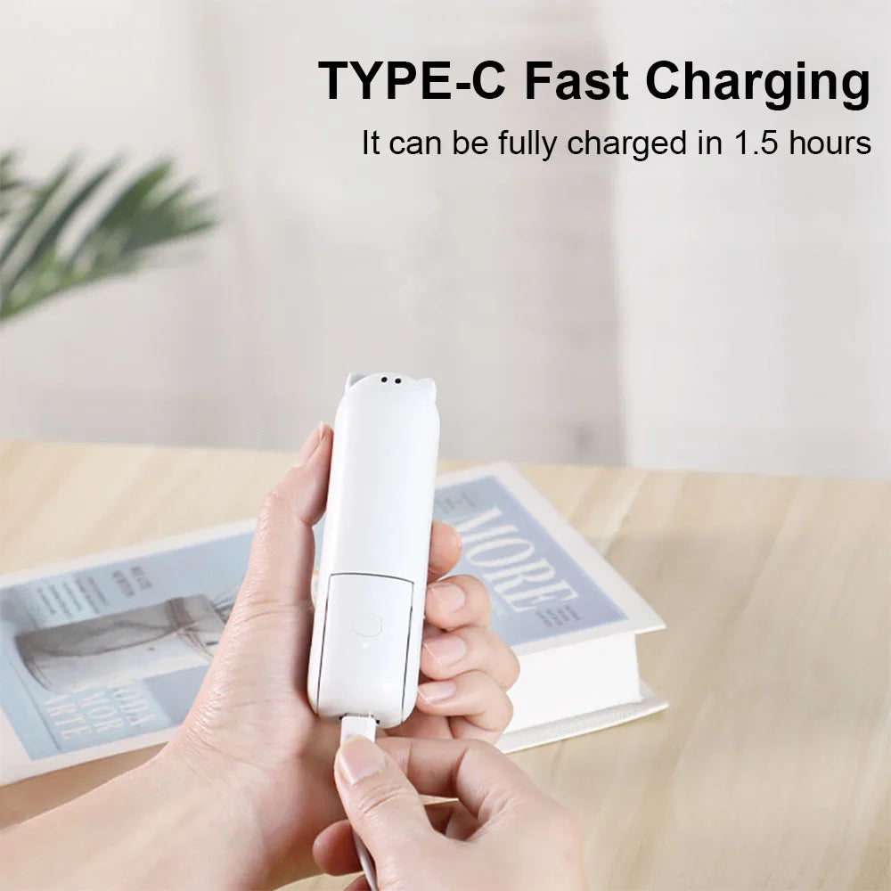 Hand holding a white USB-C charging min fan with text about fast charging on a blurred background.