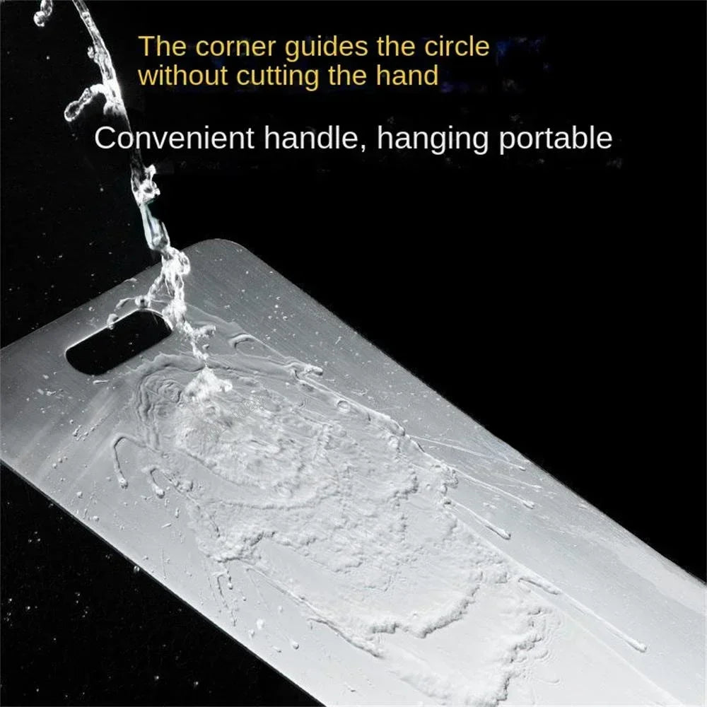 Water rinsing over a stainless steel cutting board with a convenient handle, highlighting easy cleaning and safe rounded corners