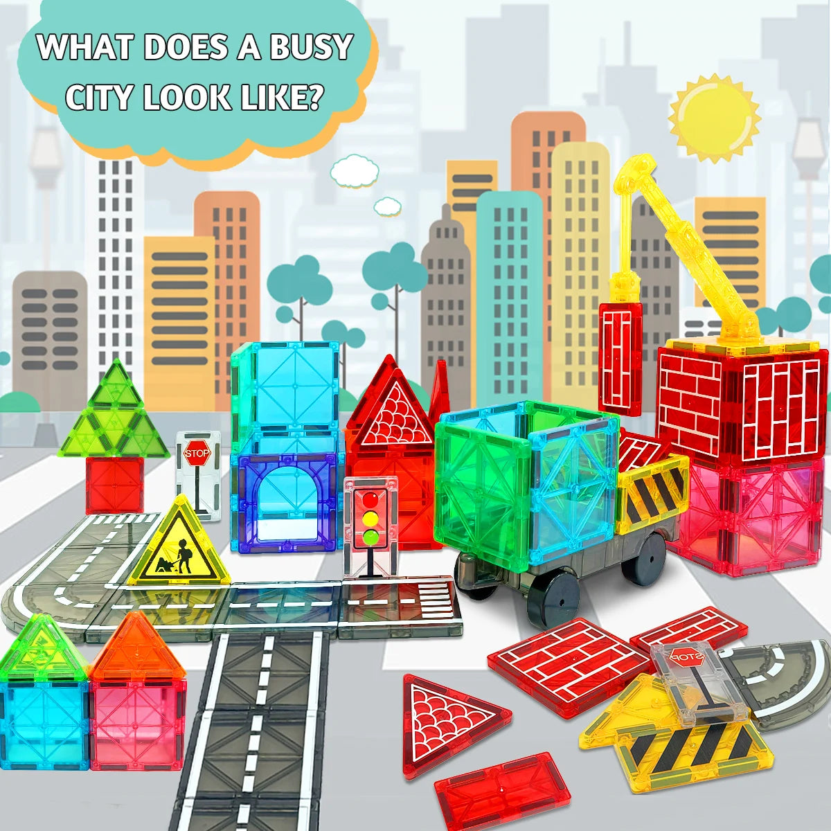 Colorful toy city set with buildings, roads, and vehicles on a light gray background.