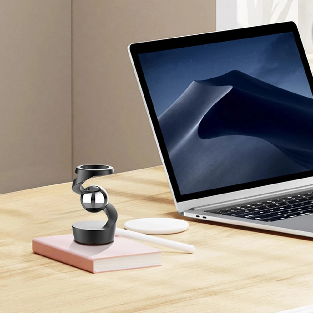Gravity Defying Kinetic Desk Spinner on desk