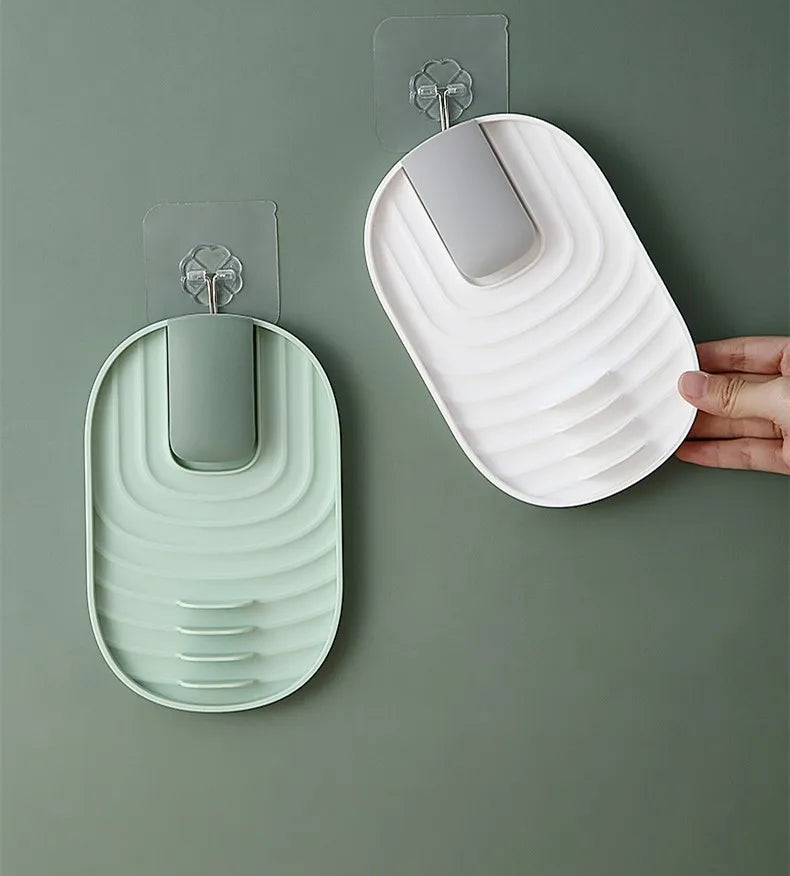 white and green spatula holders hanging on the kitchen wall