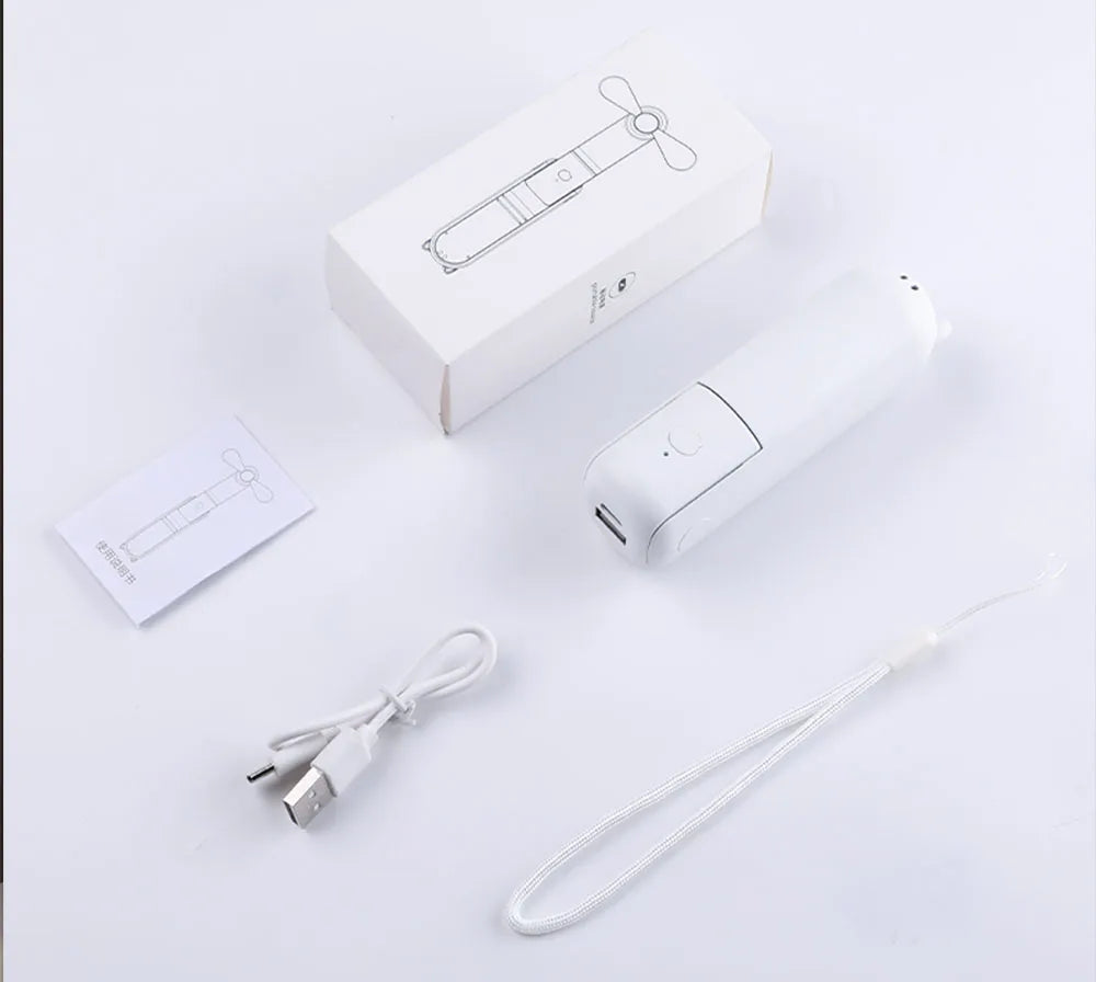 White electronic portable mini fan with USB cable and packaging on a light gray background