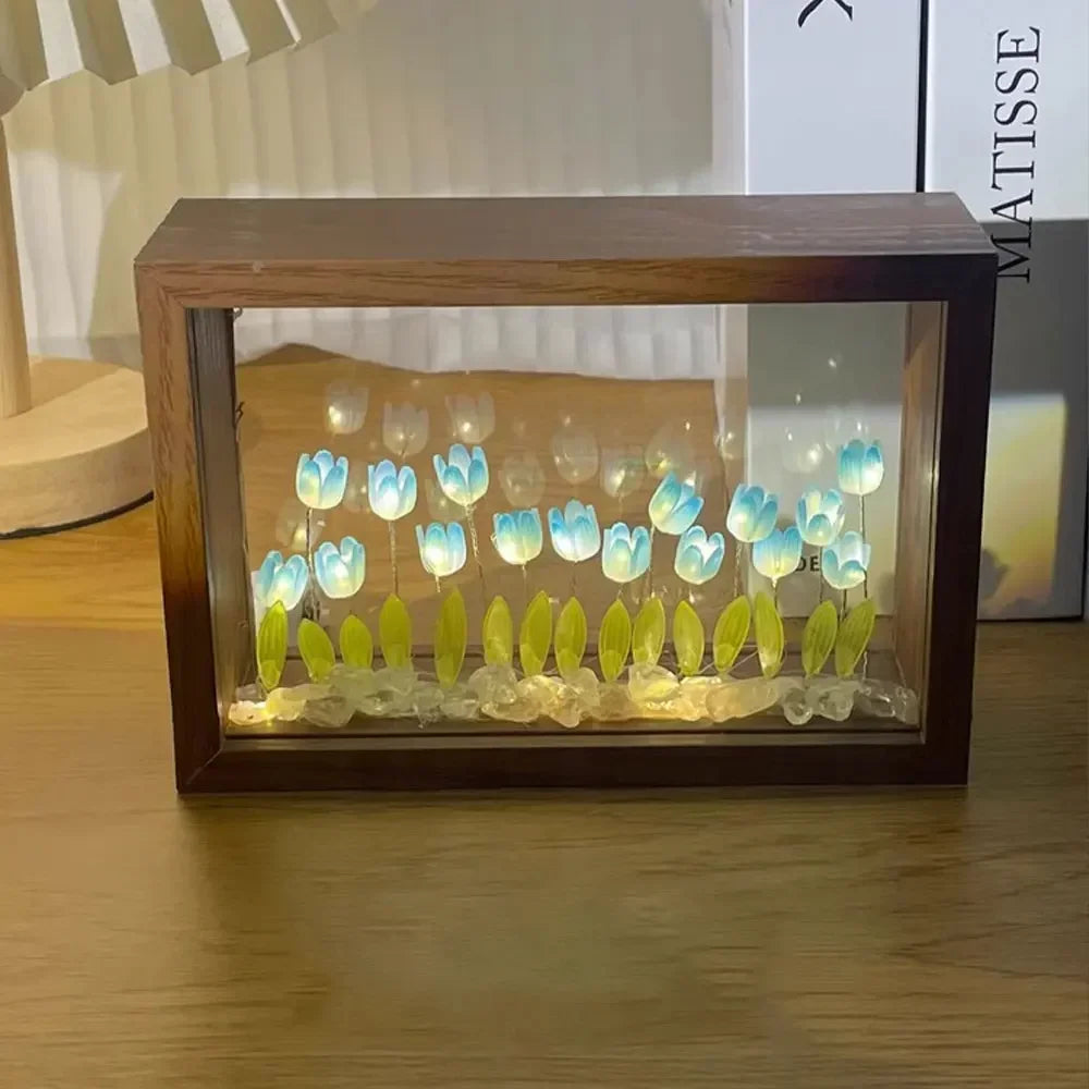 DIY wooden tulip light box with glowing blue LED flowers and green leaves, used as ambient home decor