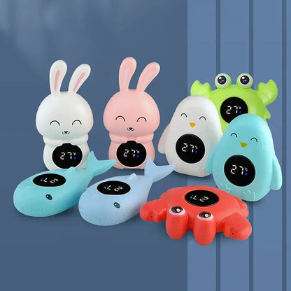 Assorted animal-shaped baby bath thermometers including bunny, whale, penguin, crab, and frog designs with digital temperature displays