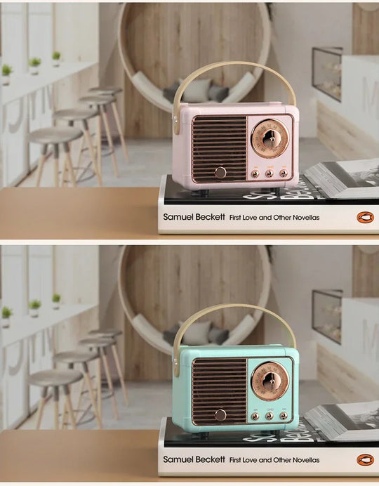 Two retro Bluetooth speakers in pink and mint green displayed on books in a modern café-style setting
