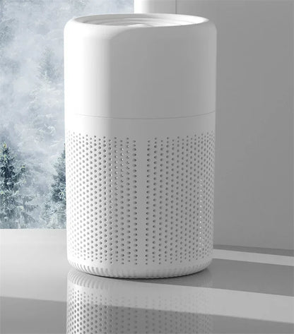 White textured air purifier on a reflective surface with a blurred background